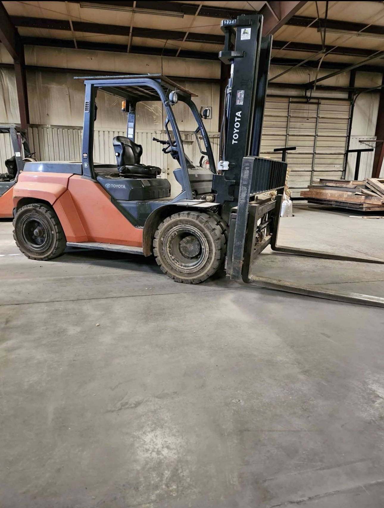 Warehouse forklift equipment staged for replacement or resale