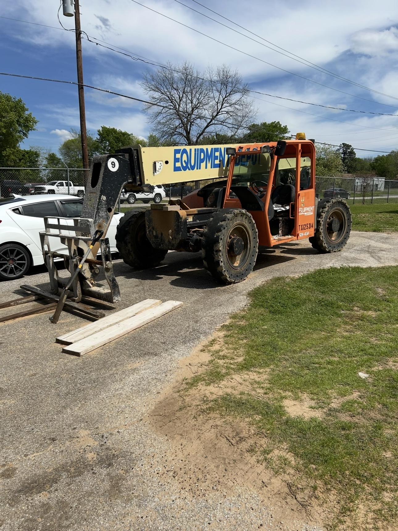 Rough terrain forklift in a city setting where its all-terrain capability is no longer being used