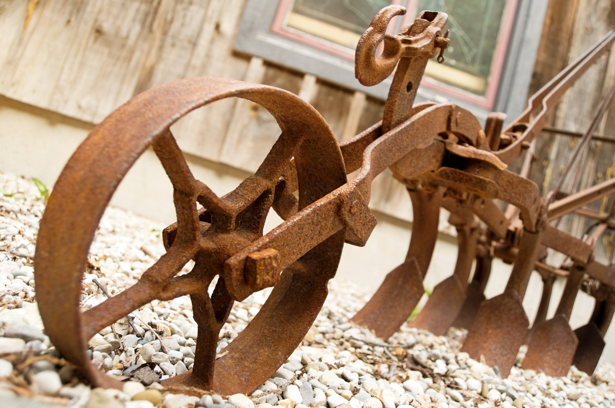 Old rusty equipment displayed outdoors like a museum piece instead of being sold while it still has value